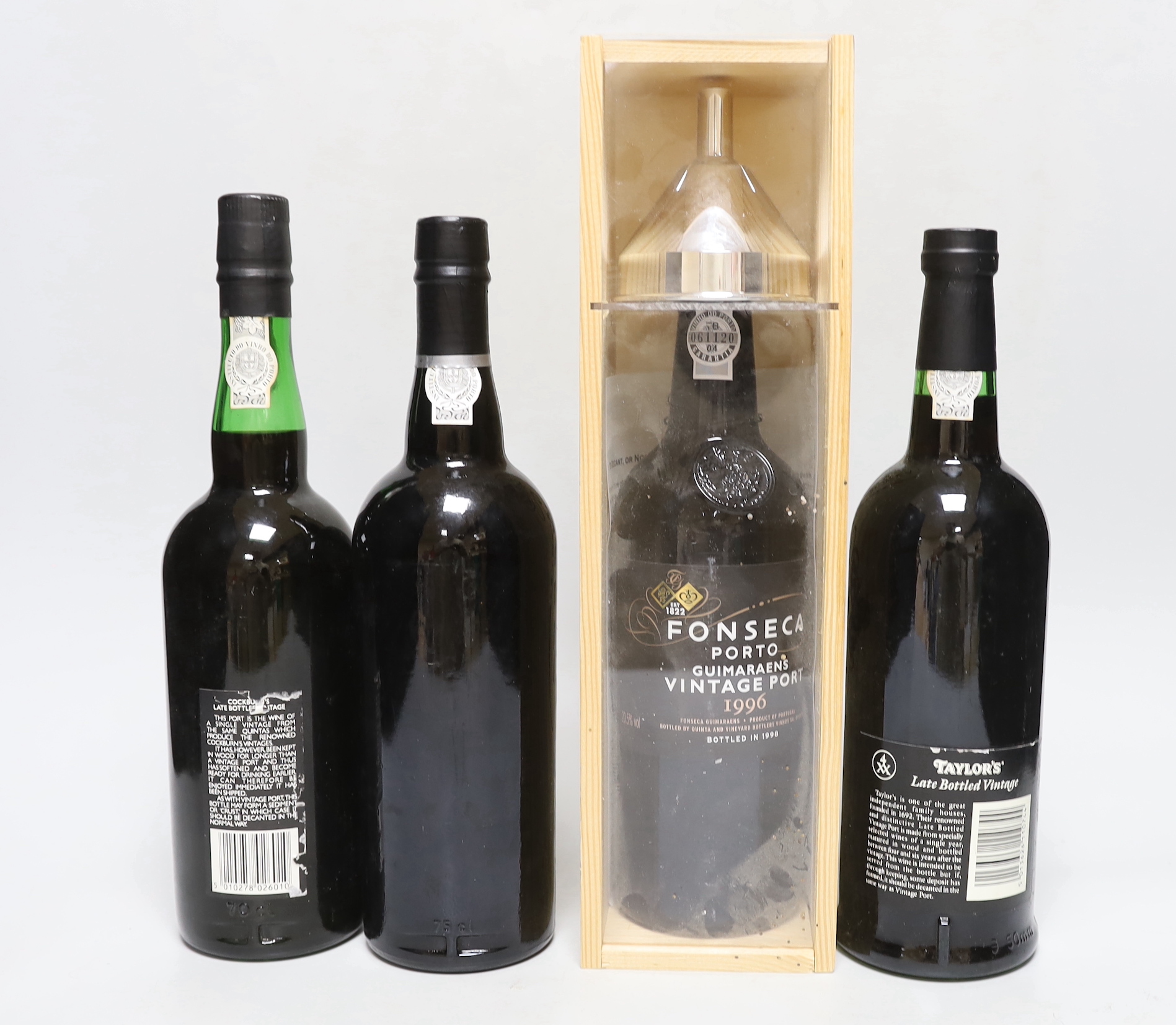 A bottle of cased Fonseca vintage port 1996, a Cockburn 1984, a Taylors 1985 and Ramos Pinto 1994